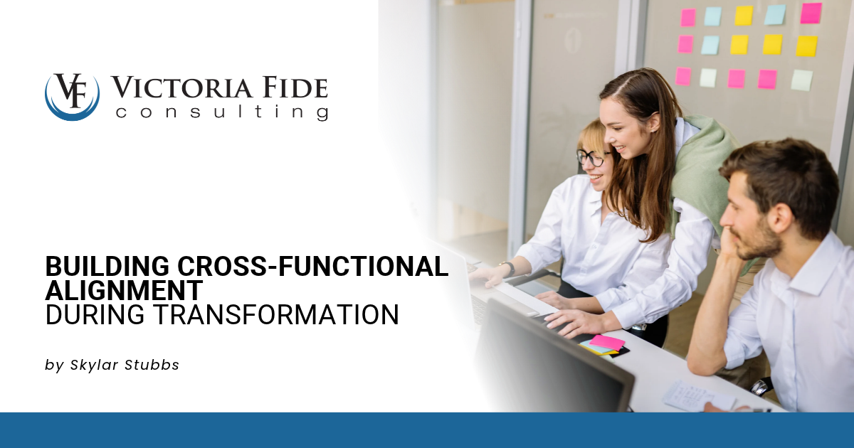 Cross-functional team mapping an end-to-end business process together on a whiteboard